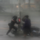 A rescuer tries to assist a motorist victim as Super Typhoon Meranti lashes Kaohsiung, Taiwan, 14 September 2016.